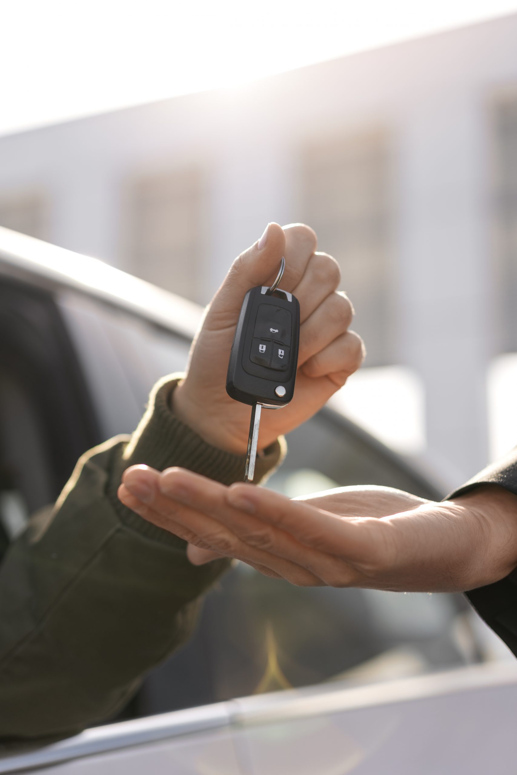 side-view-hands-holding-car-key-scaled.jpg